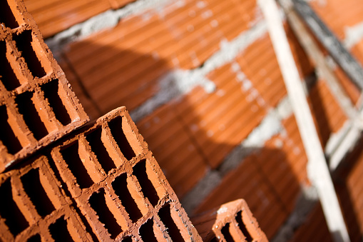 Building under construction. Details of exterior brick and cement walls- Buenos Aires - Argentina