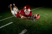 istock Wide Receiver Making a Diving Catch 152031367