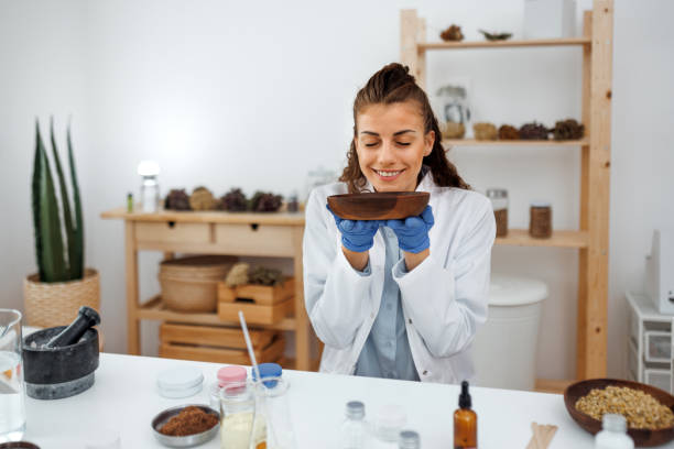 istock Young beautiful woman working with jojoba wax at her workshop 1520321549