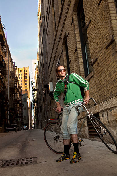 Bike Messenger in Alley stock photo