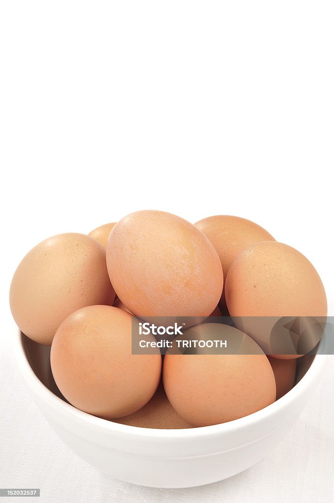 Brown Eggs in a bowl Brown Eggs in a white bowl isolated over a white background Boiled Stock Photo