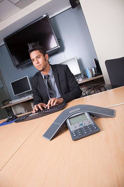 Mod businessman working at desk stock photo
