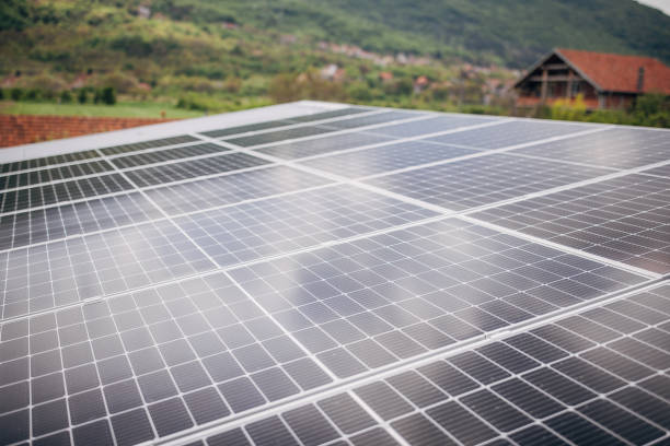 istock Solar panels on top of a roof 1520337877