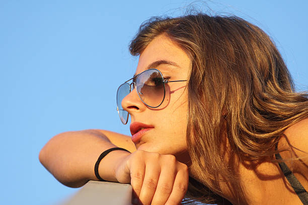 istock pensive girl with sunglasses 152034988