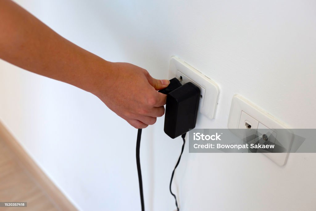 Cable Into Socket Hand Insert A Plug Into Socket Stock Photo - Download Image Now ...