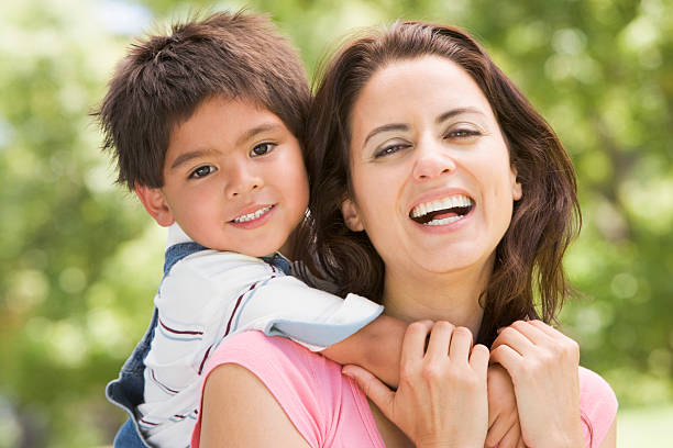 istock Mother and son outdoors embracing 152039683