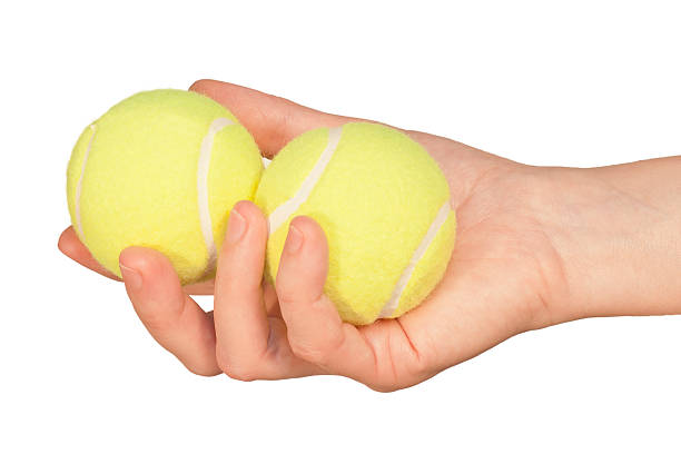 istock Tennis balls in hand 152040281