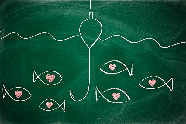 istock Love concept with fish hook and fishes on a chalkboard 152041479