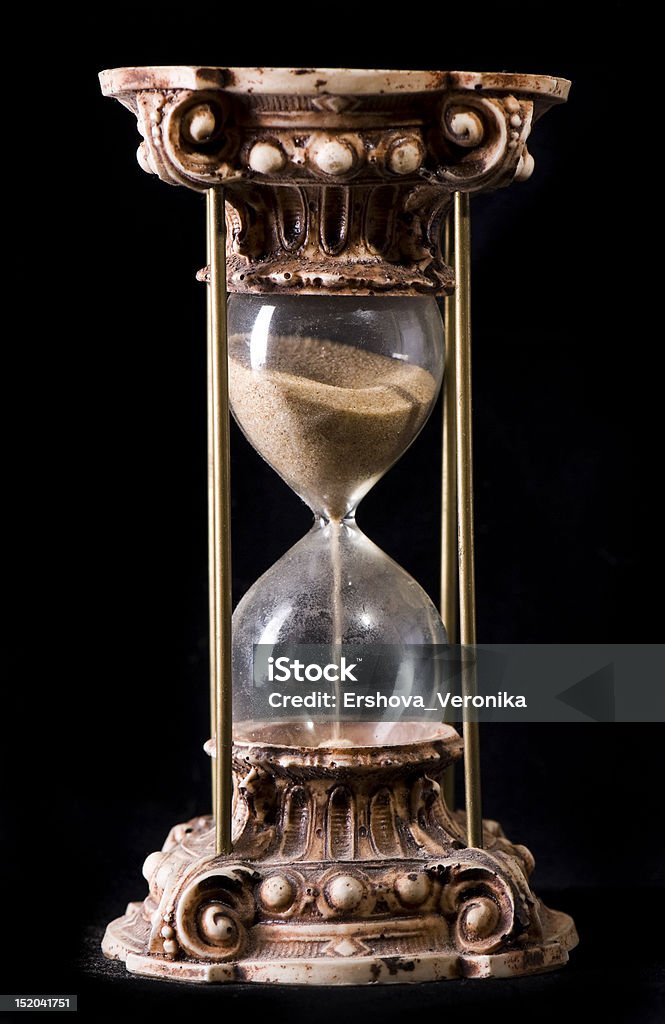 Hourglass Hourglass on dark background studio shot Aging Process Stock Photo