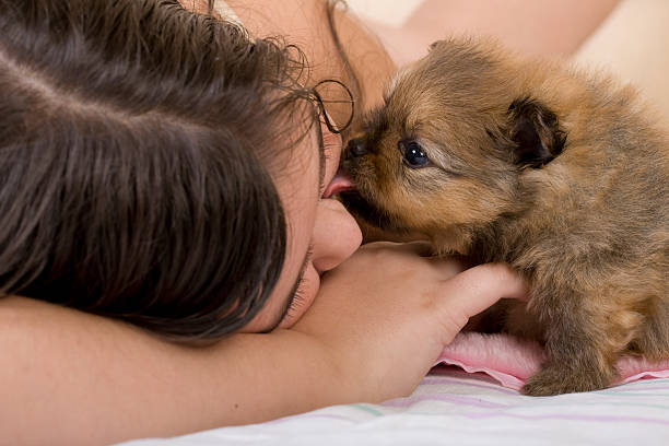 istock girl with puppy 152048678