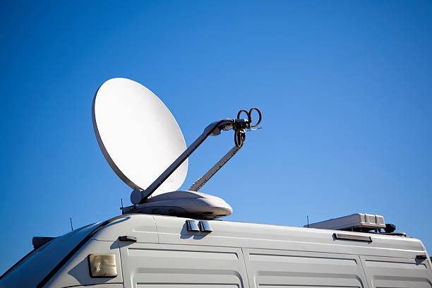 Satellite on van. Tv transmission. stock photo