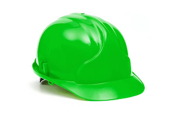 Lone bright green construction helmet on white background