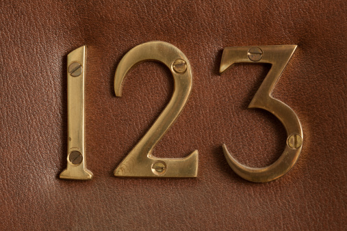 Close-up shot of door with numerals 123.