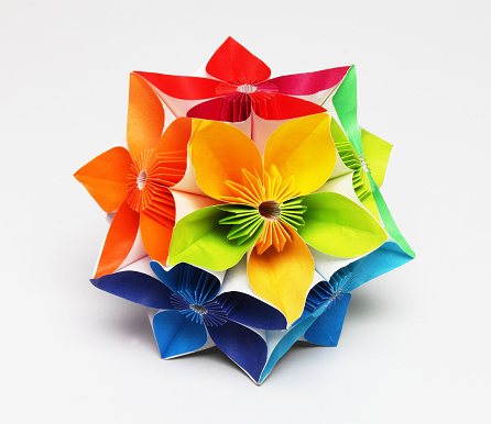 A close-up shot of a colorful origami structure made up of flower elements