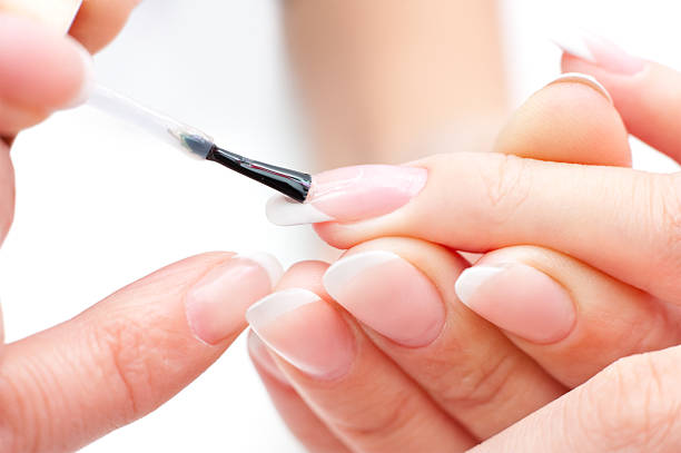 istock A pair of hands being manicured by a technician 152050797