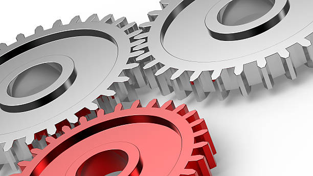 istock Two steel gears in connection with red one 152053209