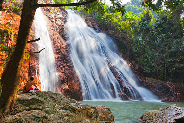 istock Beautiful waterfalls in the woods falling into a lake 152053699