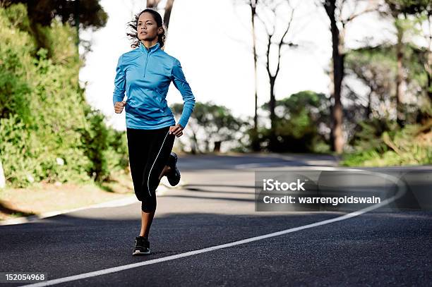 Female Athlete Running In The Street Stock Photo - Download Image Now - Active Lifestyle, Activity, Adult