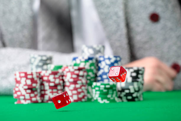 istock Red dice are rolling on casino  table 152059350
