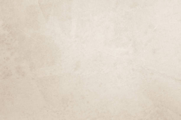 istock Colour old concrete wall texture background. Close Up retro plain cream color cement wall background texture. Design paper vintage parchment element show or advertise or promote product on display. 1520616200
