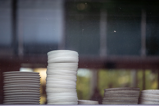 stacks of plates prepaired for catering event.