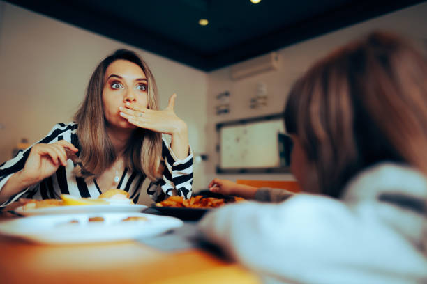 istock Mother and Daughter Consuming Bad Spoiled Food 1520644851
