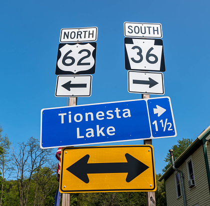 Directional road signs for State Routes 62 and 36 as well as Tionesta Laken Tionesta, Pennsylvania, USA on a sunny spring day