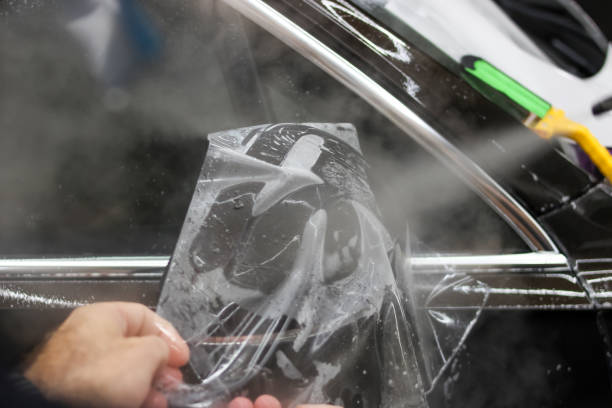 istock The process of installing PPF on the side mirror. PPF is a protective film for paint that protects the paint from scratches and gravel.Anti-gravity protection. PFF is installed. Car wrapping close-up. 1520723655