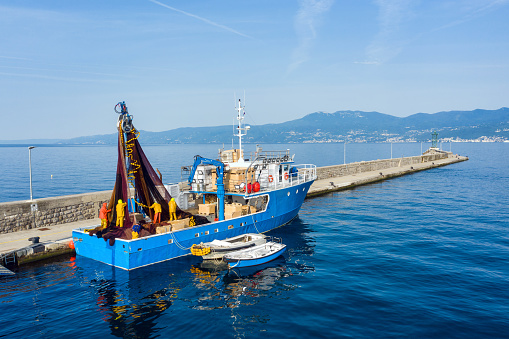 A trawler unloads caught fish in the port of Rijeka, Croatia
