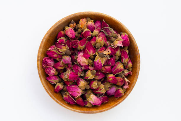 istock Dried roses for tea on white background. 1520749713