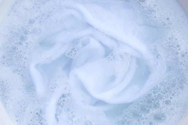 istock Top view of towel soak in powder detergent water dissolution. Laundry concept 1520755677