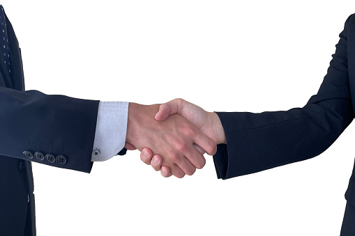 Two businessmen shaking hands firmly