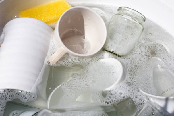 istock Washing used drinking glasses and cups 1520865915