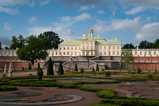 Lomonosov, Saint Petersburg, Russia, 07.02.2023: The Grand (Menshikov) Palace with the lower garden in the Oranienbaum Palace and Park ensemble on a sunny summer day