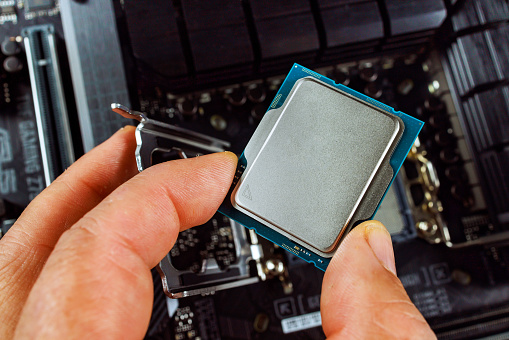 Assembly Process Of A Desktop Computer Involves Technician Plugging Cpu ...