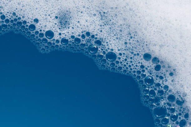 istock Detergent foam bubble on wate. Blue background, Soap sud 1520935035