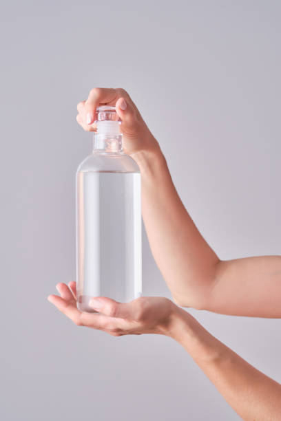 istock Bottle with water in female hands. 1520976631