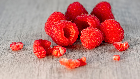 Several fresh ripe raspberries close up