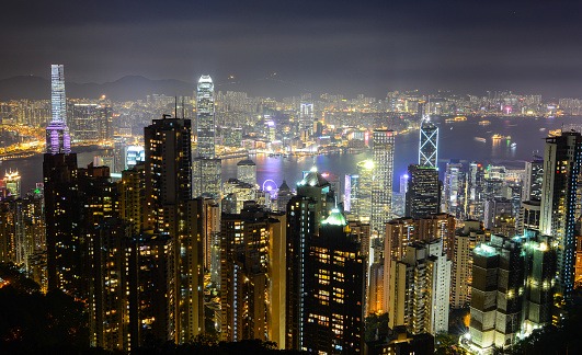 Hong Kong - Dec 30, 2014. Cityscape of Hong Kong at night. Hong Kong is ranked second in the world by the most billionaires per capita.