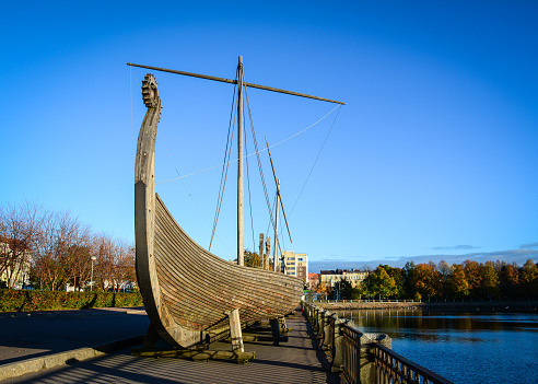 Vyborg, Russia - Oct 5, 2016. Drakkar (Viking wooden boat) on the waterfront in Vyborg, Russia. Vyborg is 174km northwest of St Petersburg and just 30km from the Finnish border.