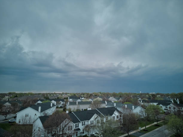 istock stormy clouds forming on gloomy sky before heavy rainfall over suburban area. 1521051800