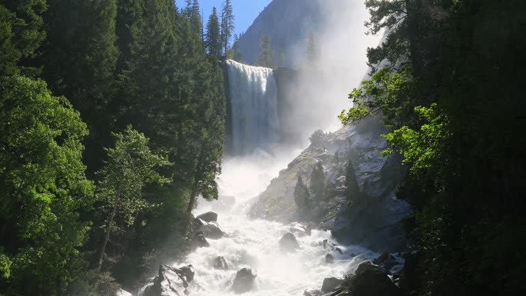 Vernal Falls with powerful flowing water from rushing river and flooding in Yosemite National Park