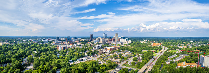 Panorama view of downtown Raleigh, North Carolina with blue sky background.