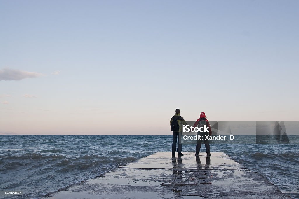 romantic backpackers romantic couple on sea pier Above Stock Photo