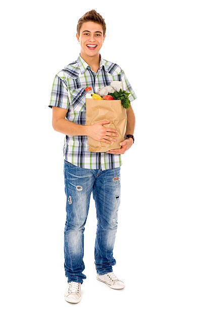 istock Young man carrying a grocery bag 152110124