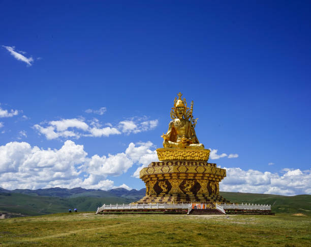 istock Big Buddha on the grass hill at Yarchen Gar 1521113595
