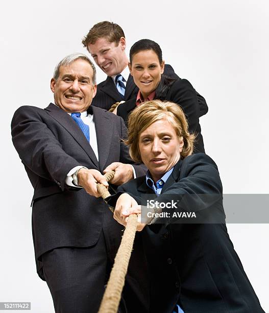 Business People Playing Tugofwar As A Team Stock Photo - Download Image Now - Tug-of-war, Business Person, 20-24 Years