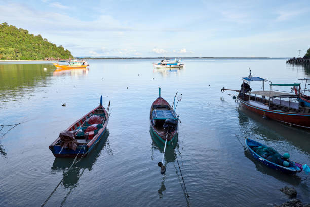 istock Fishing boat docking on  pier 1521121202