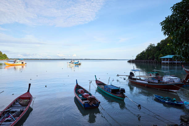 istock Fishing boat docking on  pier 1521121206