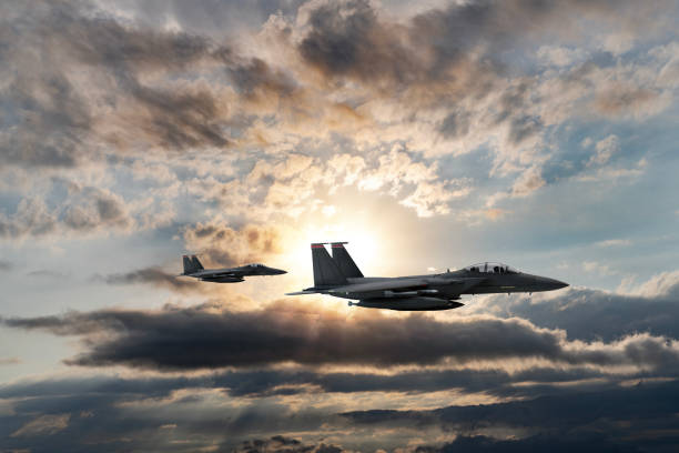 istock Jet aircrafts flying over the clouds at sunset. 1521121363